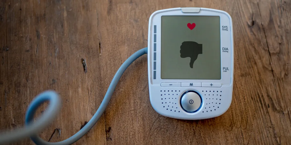 bad blood pressure or pulse is displayed with a thumbs down symbol on a modern medical health care device