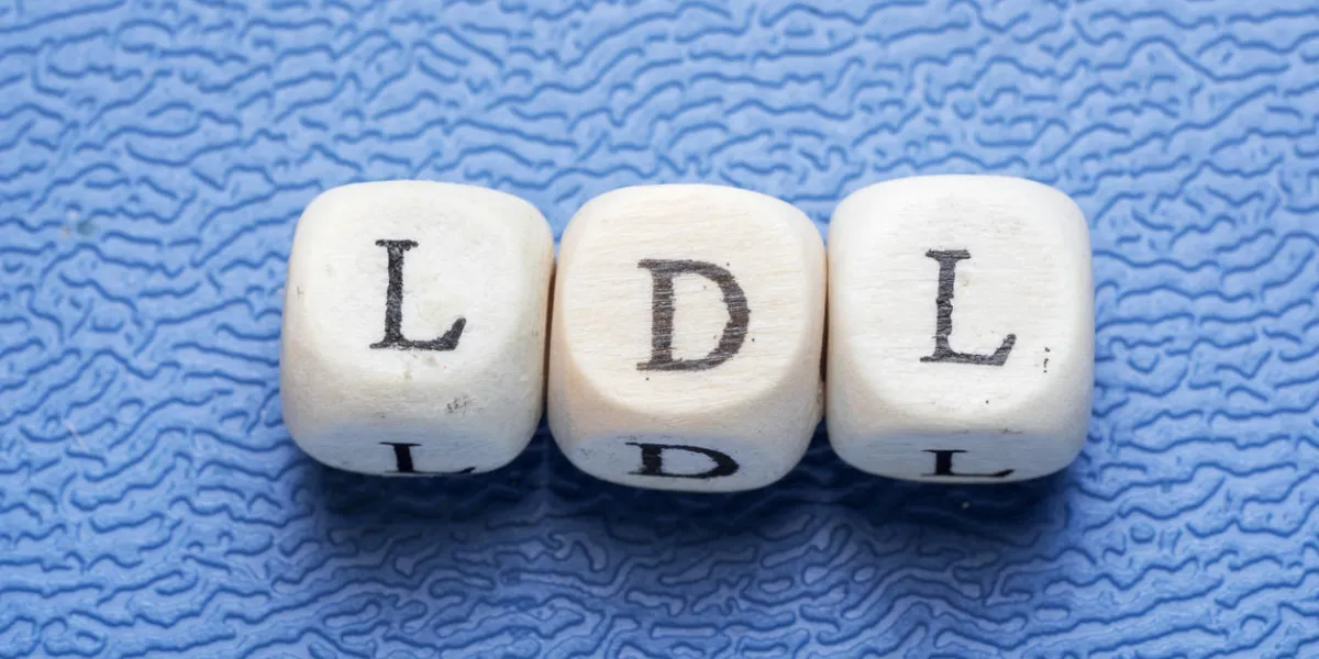 word ldl (low-density lipoprotein) on a wooden cubes on a blue background