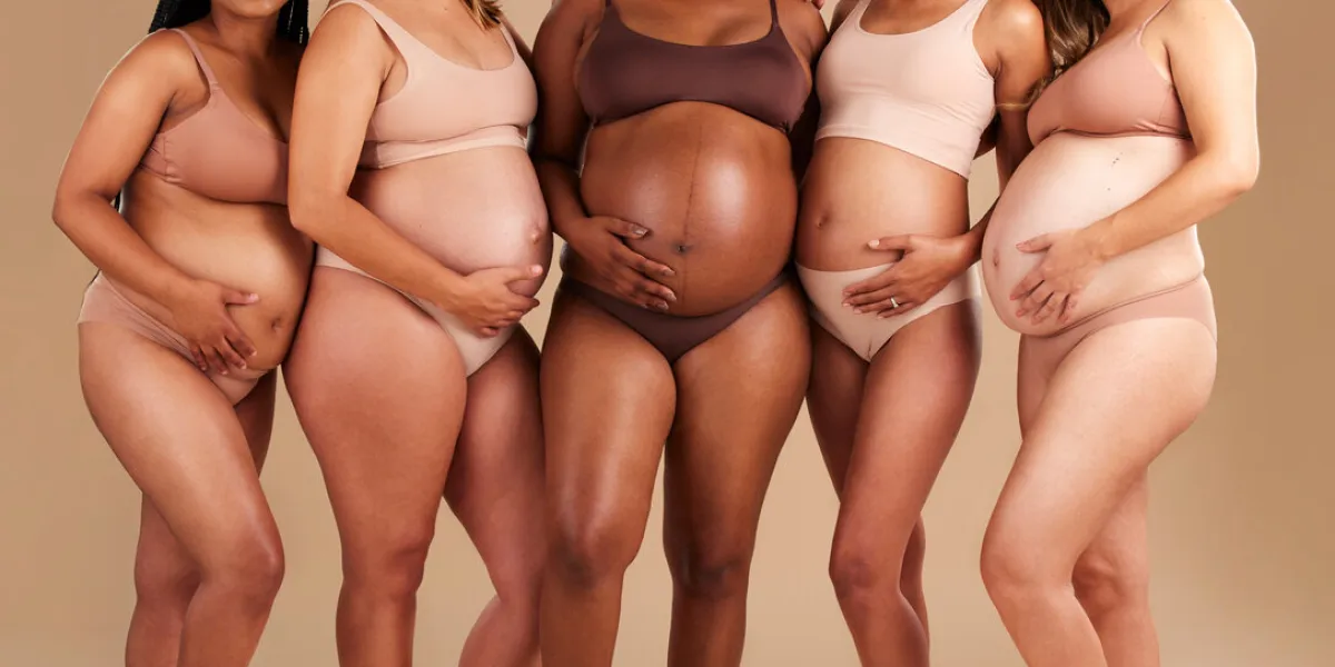 pregnancy, diversity and portrait of friends in studio for community, motherhood and prenatal wellness maternity, love and pregnant women showing their baby bump stomach together by beige background pregnancy, diversity and portrait of friends in studio for community, motherhood and prenatal wellness maternity, love and pregnant women showing their baby bump stomach together by beige background