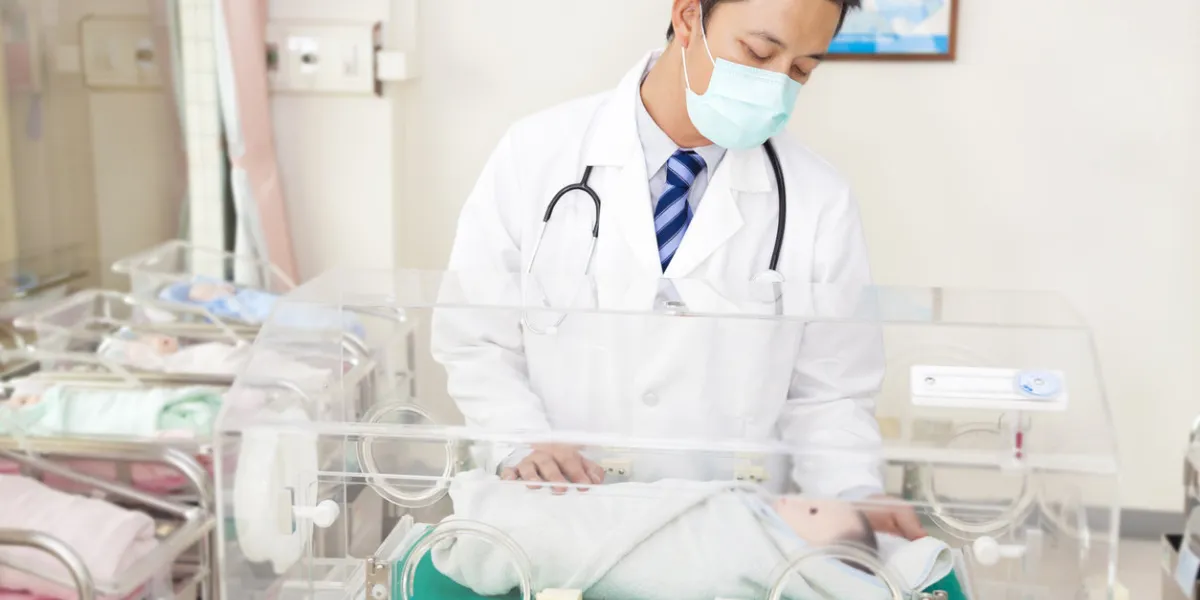 doctor examine a infant fake body situation in a baby room doctor examine a infant fake body situation in a baby room