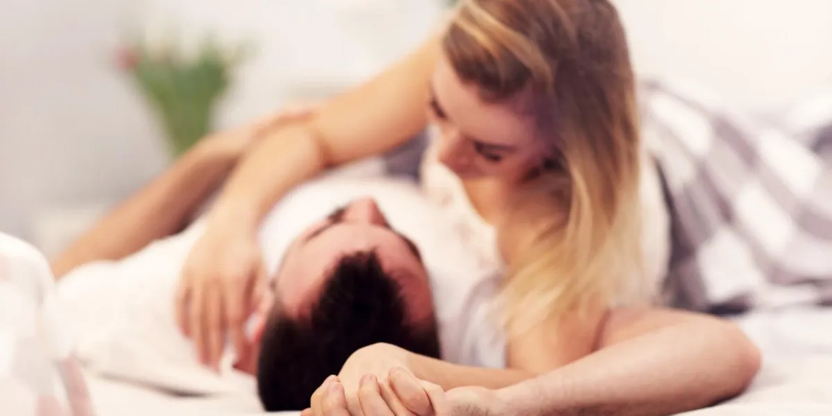 picture showing sexy young lovers being intimate in bed picture showing sexy young lovers being intimate in bed