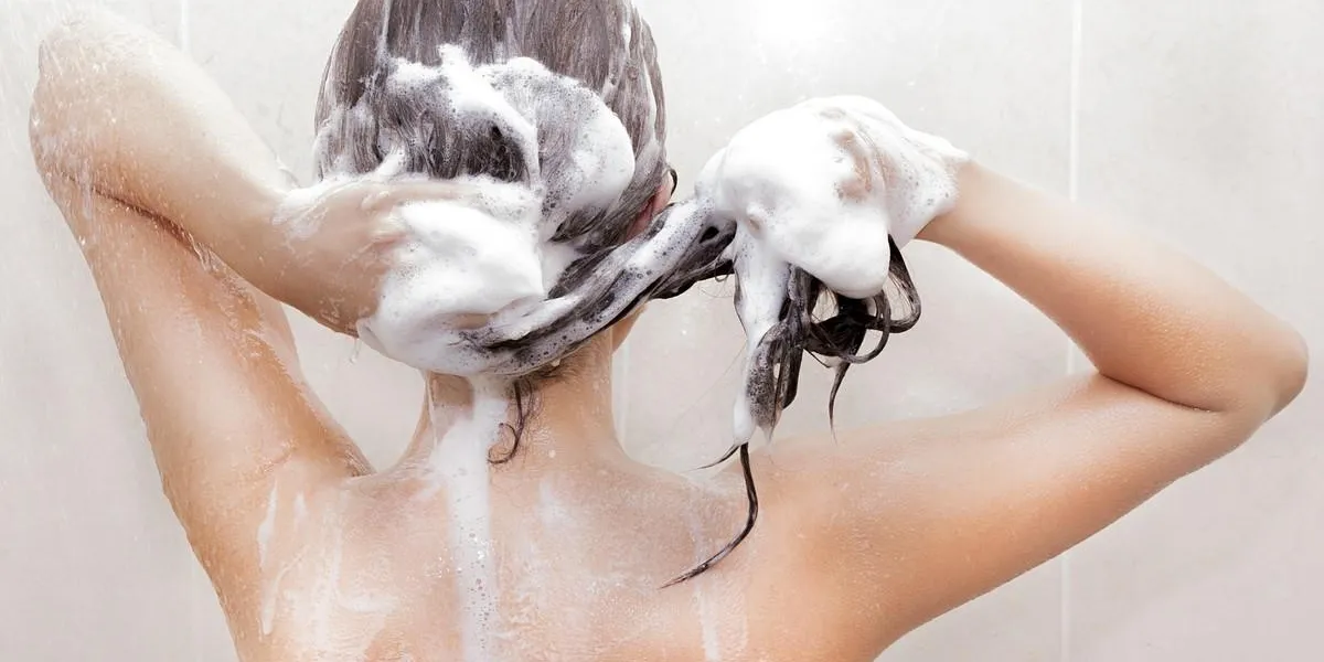 woman washing her hair woman washing her hair