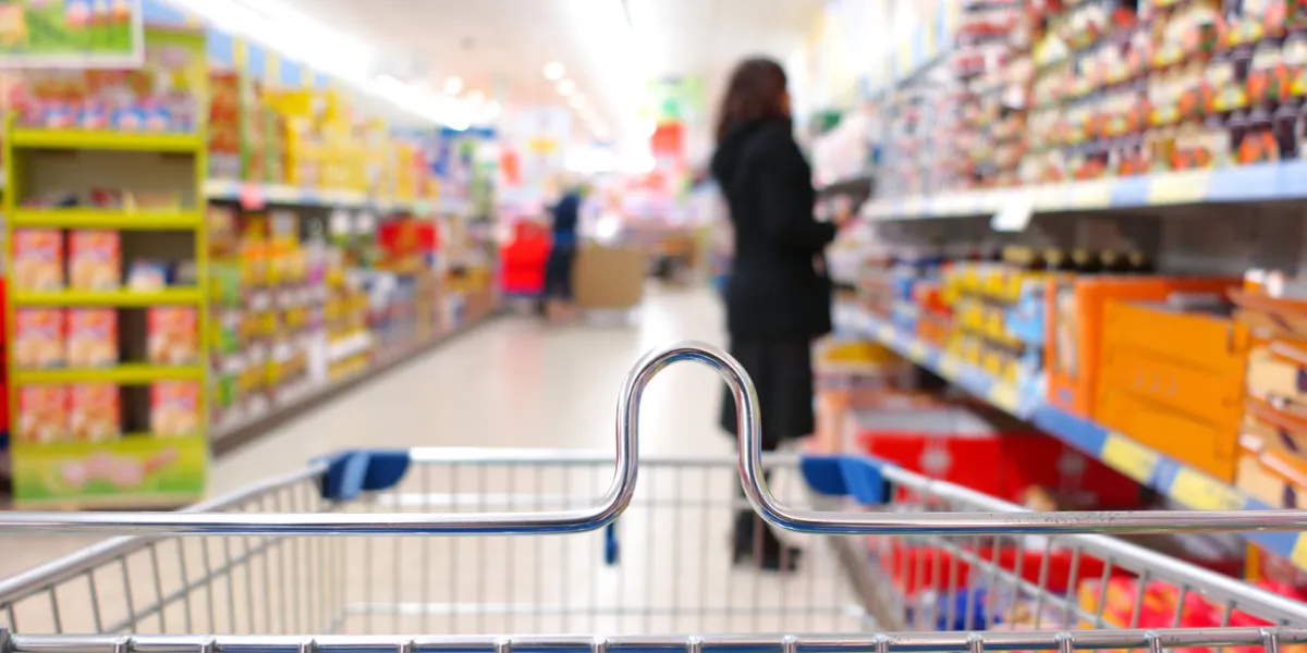 woman shopping at the supermarket with trolley woman shopping at the supermarket with trolley