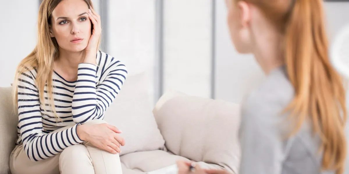 mental health and counseling concept, psychologist listening to depressed female patient and writing down notes mental health and counseling concept, psychologist listening to depressed female patient and writing down notes