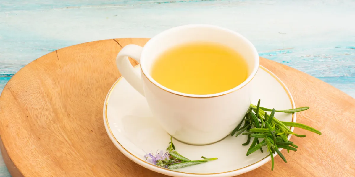 infusion of rosemary flower in white cup