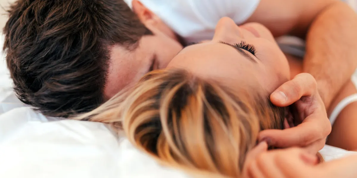 happy couple in bedroom enjoying sensual foreplay
