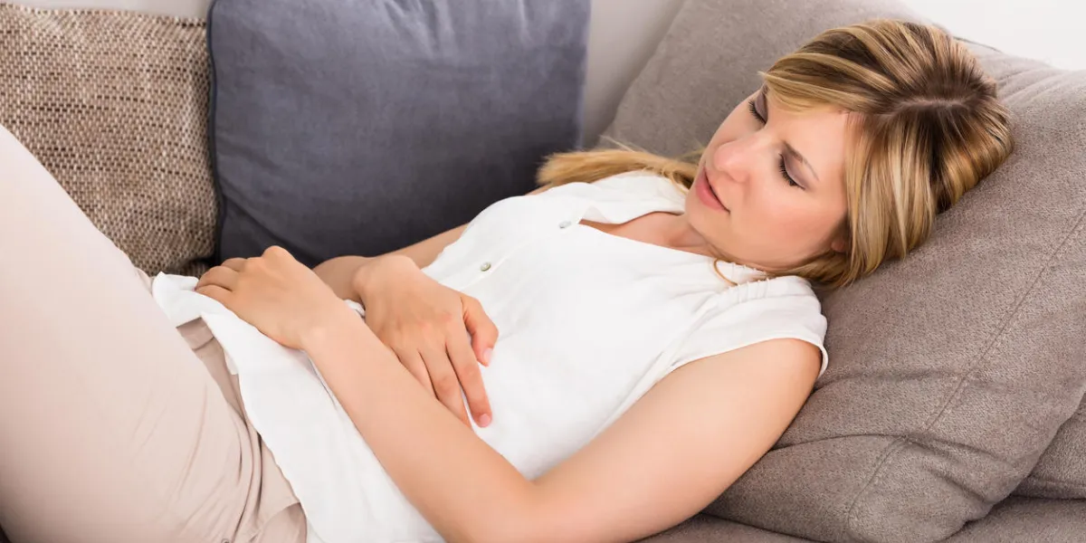 close-up of young woman having stomach pain close-up of young woman having stomach pain