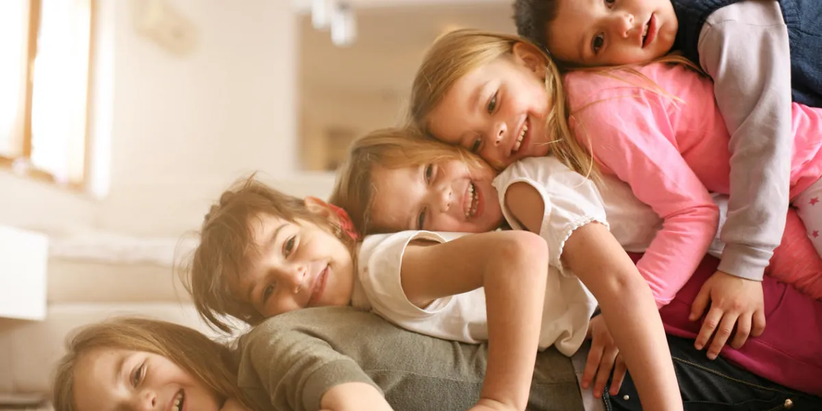 large group of children lying at floor and having fun looking at camera large group of children lying at floor and having fun looking at camera