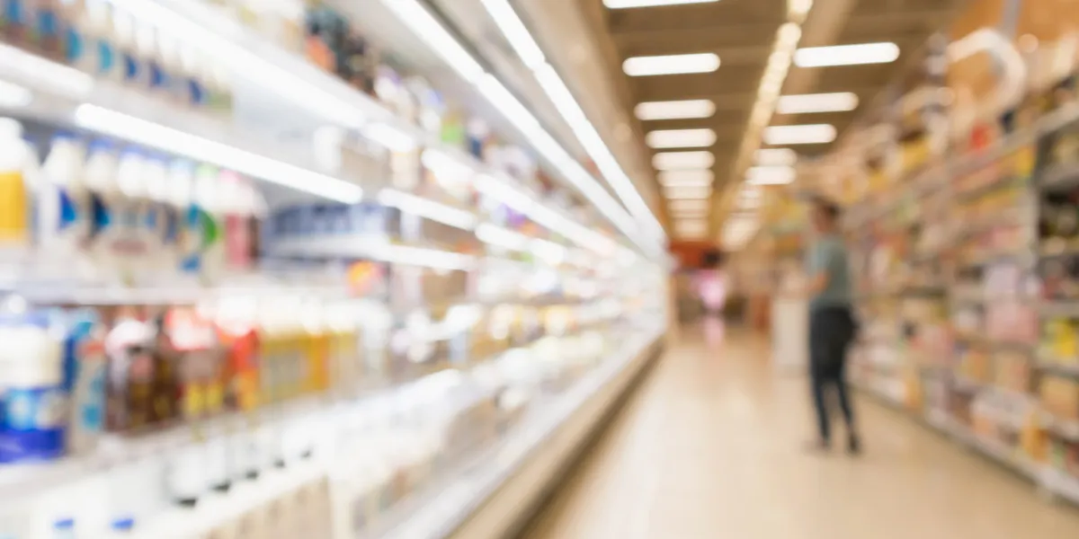 abstract blur supermarket discount store aisle and product shelves interior defocused background abstract blur supermarket discount store aisle and product shelves interior defocused background