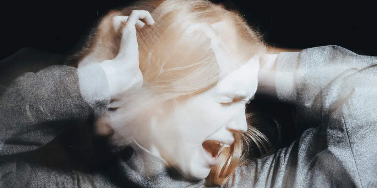 young woman screaming because of delusions and hallucinations young woman screaming because of delusions and hallucinations
