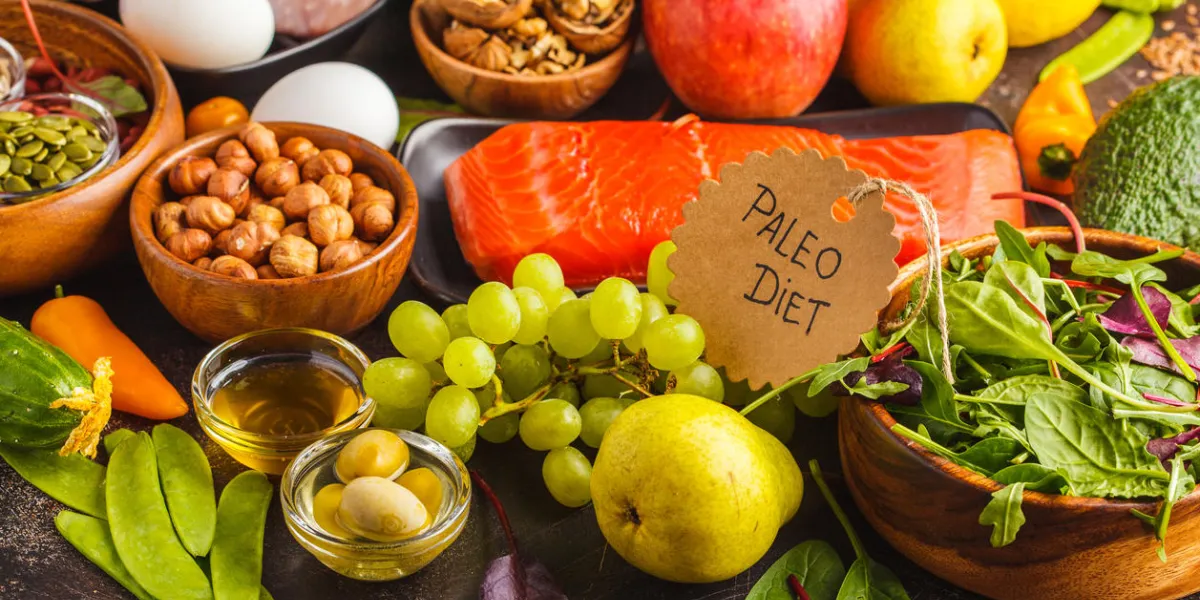 paleo diet concept balanced food background on the table copy space, dark background fresh raw vegetables, fruits, meat, fish, top view paleo diet concept balanced food background on the table copy space, dark background fresh raw vegetables, fruits, meat, fish, top view