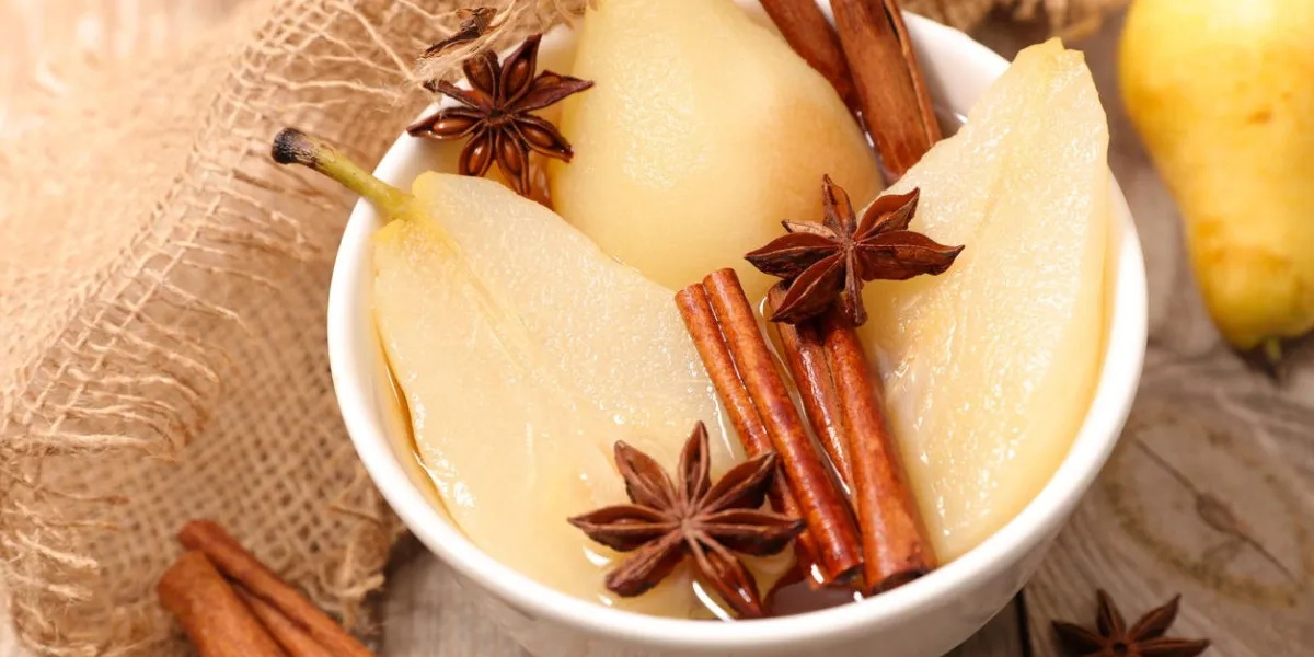 poached pear with syrup and spices poached pear with syrup and spices