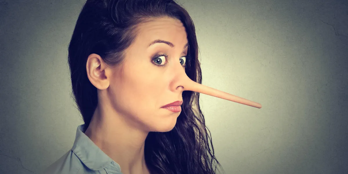 woman with long nose isolated on grey wall background liar concept human face expressions, emotions, feelingsn