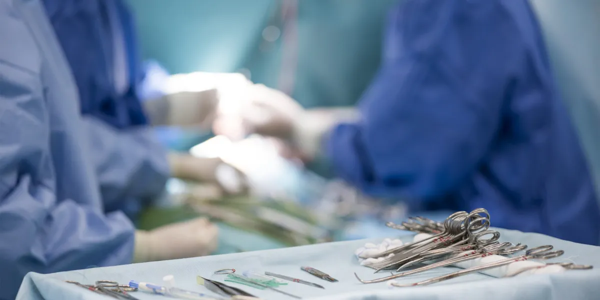 sterile surgical instruments on during the operation table amid the surgeons sterile surgical instruments on during the operation table amid the surgeons