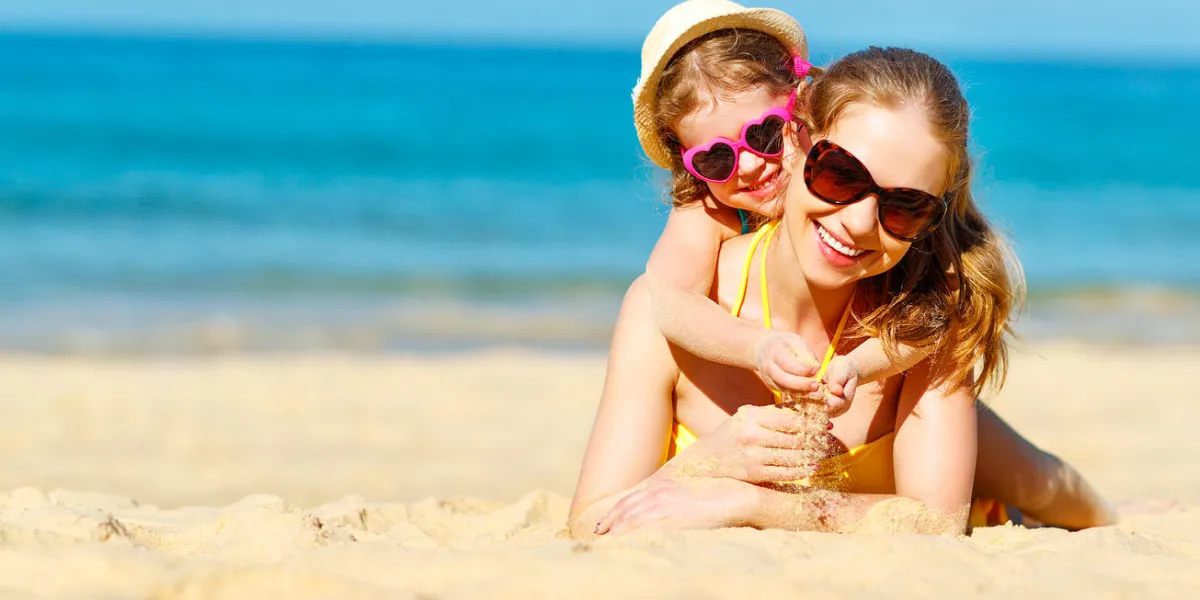 happy family mother and child daughter for swimming on beach in summer happy family mother and child daughter for swimming on beach in summer