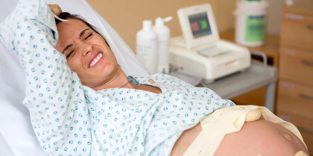 pregnant woman in delivery room, having contractions