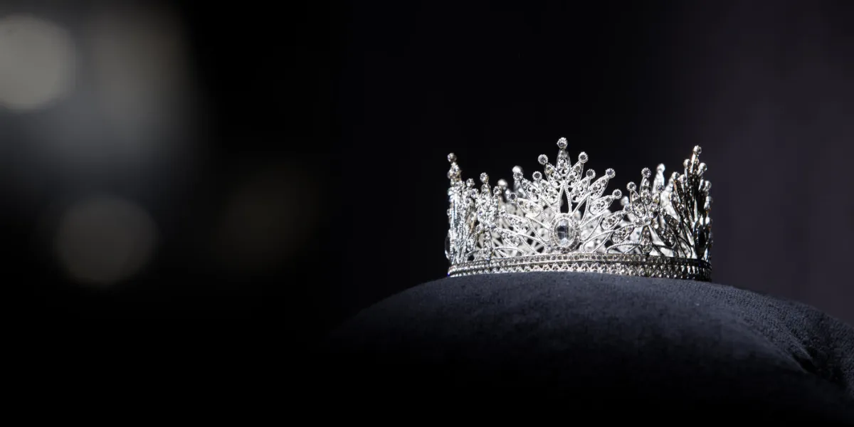 diamond silver crown for miss pageant beauty contest, crystal tiara jewelry decorated gems stone and abstract dark background on black velvet fabric cloth, macro photography copy space for text logo diamond silver crown for miss pageant beauty contest, crystal tiara jewelry decorated gems stone and abstract dark background on black velvet fabric cloth, macro photography copy space for text logo
