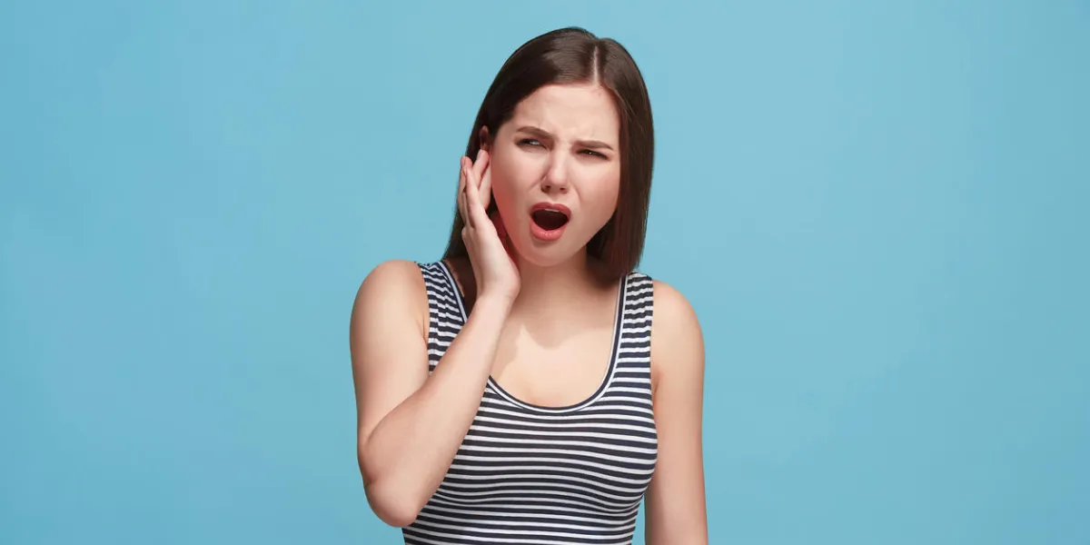 expressive woman against blue background expressive woman against blue background