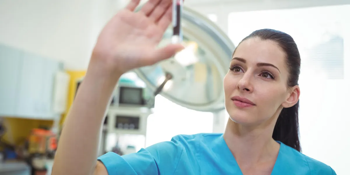 close-up of nurse looking at the blood sample