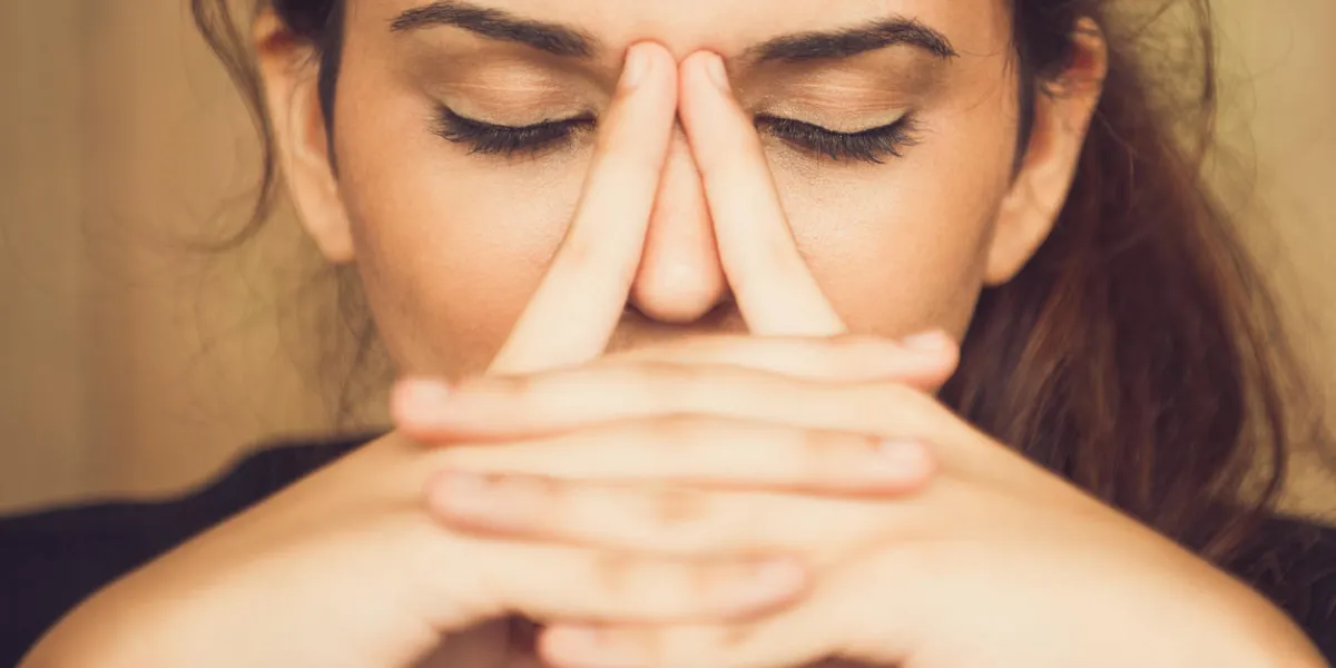close-up of face of tired young caucasian woman rubbing nose businesswoman suffering stress or depression close-up of face of tired young caucasian woman rubbing nose businesswoman suffering stress or depression
