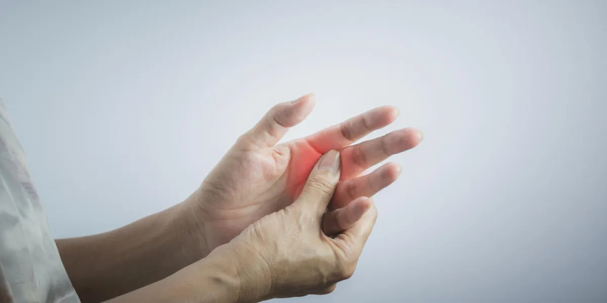 woman massaging her painful hand woman holding her hand, pain concept