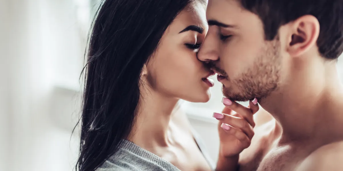 close-up of young romantic couple is kissing and enjoying the company of each other at home close-up of young romantic couple is kissing and enjoying the company of each other at home