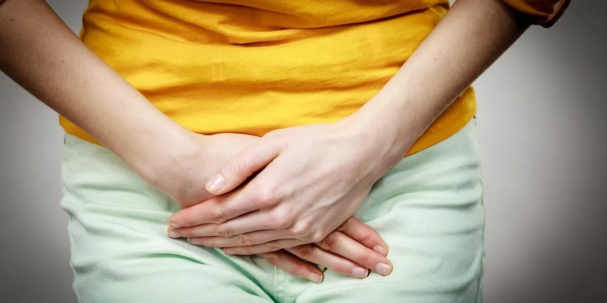 part of body young sick woman with hands holding pressing her crotch lower abdomen medical or gynecological problems, healthcare concept