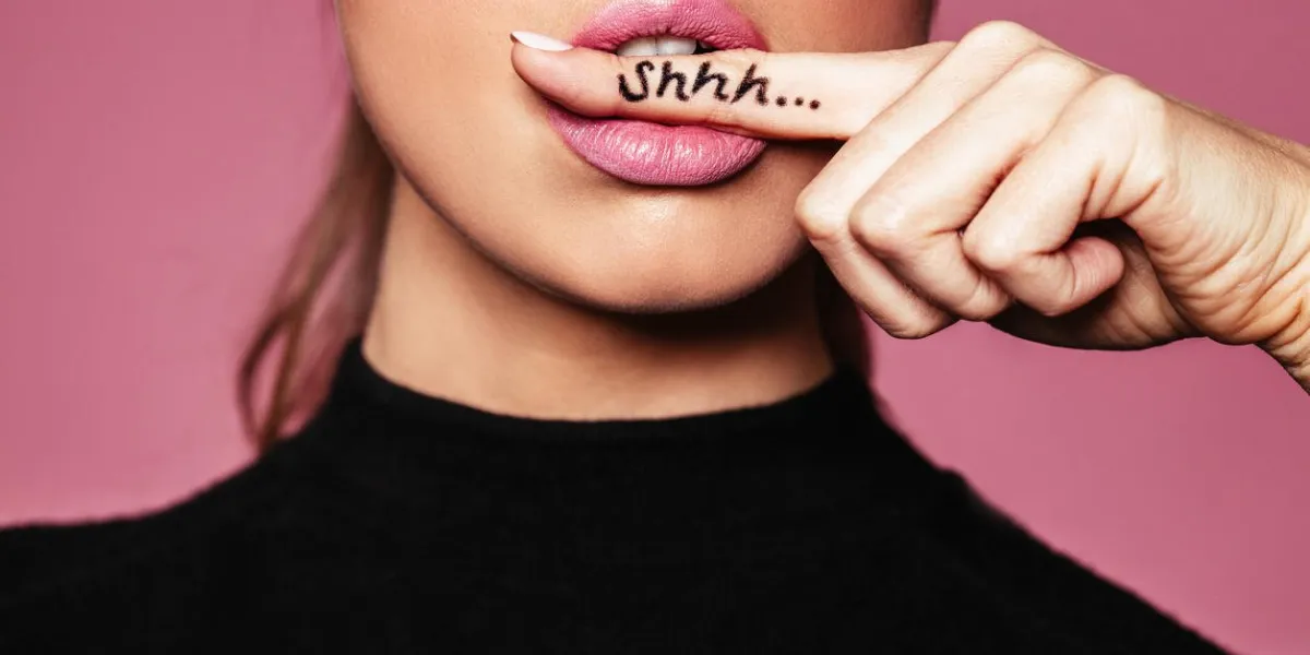 shh women's secrets cropped shot of female with finger in mouth closeup portrait of young woman is showing a sign of silence with shhh written on the finger shh women's secrets cropped shot of female with finger in mouth closeup portrait of young woman is showing a sign of silence with shhh written on the finger