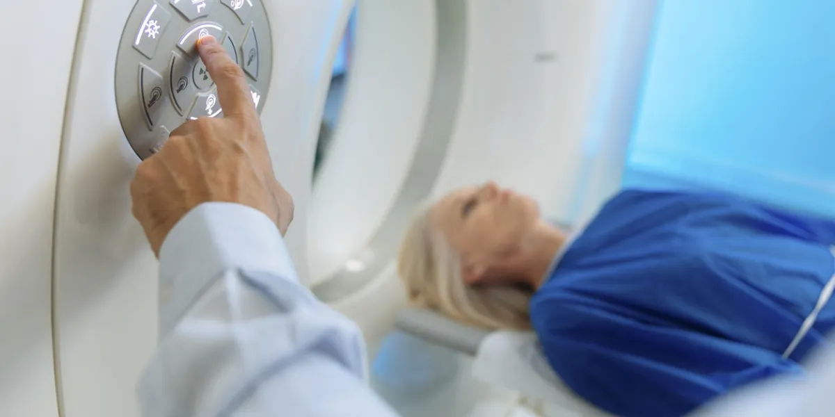 radiologic technician and patient being scanned and diagnosed on ct (computed tomography) scanner in hospital radiologic technician and patient being scanned and diagnosed on ct (computed tomography) scanner in hospital