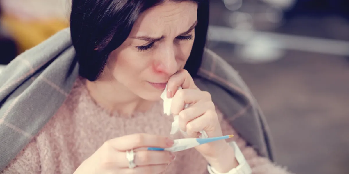 cold symptoms depressed sad pleasant woman looking at the thermometer and wiping her nose while having cold symptoms cold symptoms depressed sad pleasant woman looking at the thermometer and wiping her nose while having cold symptoms