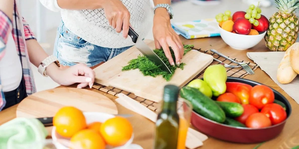 gorgeous young women preparing dinner in a kitchen concept cooking, culinary, healthy lifestyle