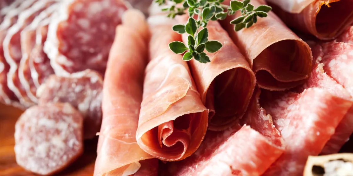 cold cuts  charcuterie assortment on wooden board