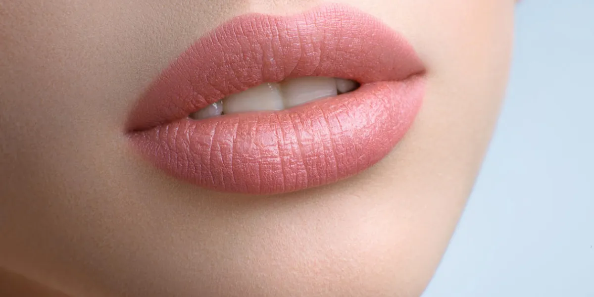 sensual lips close up cropped shot of gorgeous sexy plump lips of a beautiful woman natural makeup pink lipstick applied lip augmentation fillers beauty cosmetology sexuality seduction feminine