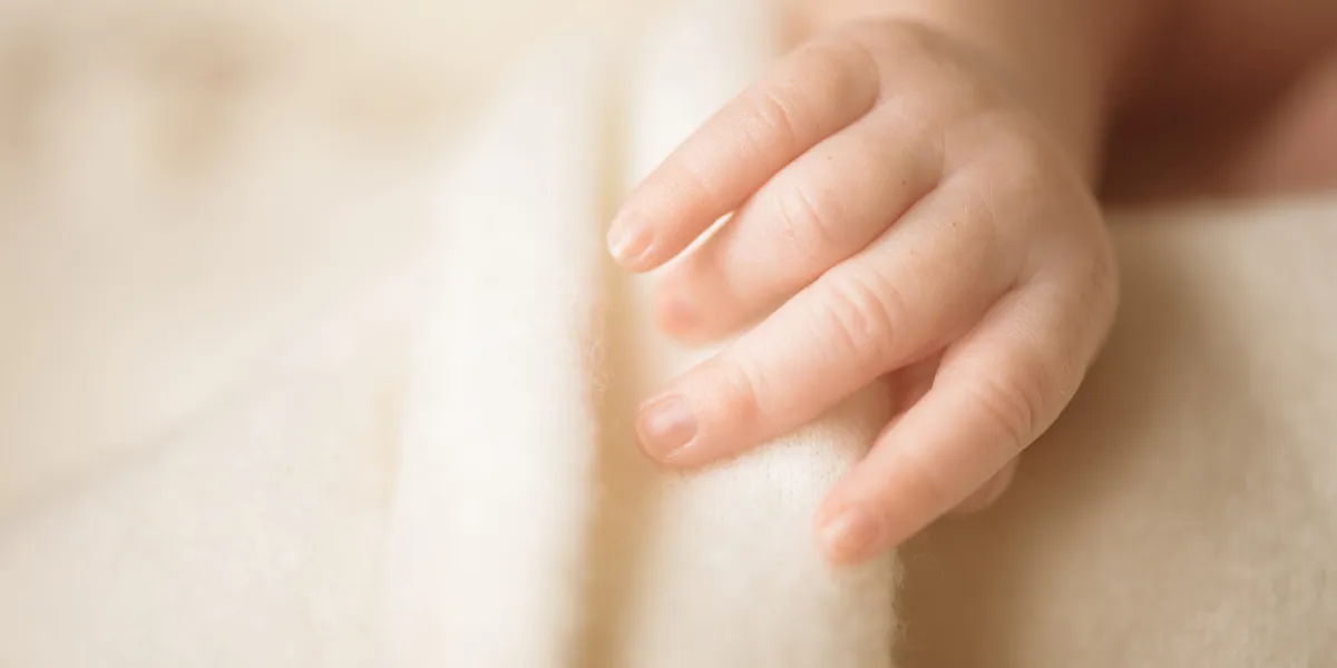 little hand of newborn baby mom and her child maternity, family, care and birth concept copy space for your text little hand of newborn baby mom and her child maternity, family, care and birth concept copy space for your text