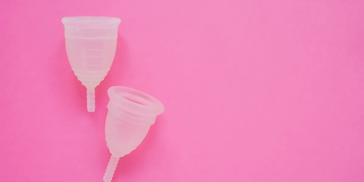 two menstrual cup on bright pink background alternative feminine hygiene product during the period women health concept copy space