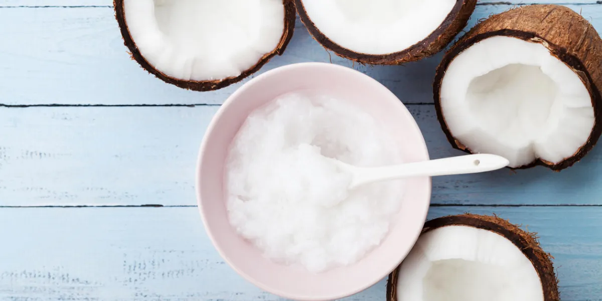 coconuts fruit with coconut oil on blue wooden table top view beauty and spa organic cosmetic flat lay coconuts fruit with coconut oil on blue wooden table top view beauty and spa organic cosmetic flat lay