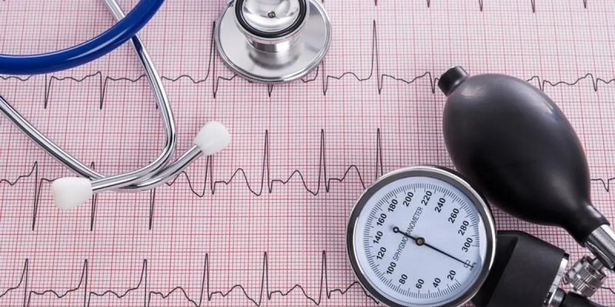 sphygmomanometer with aneroid gauge and stethoscope with electrocardiogram paper, still life photo