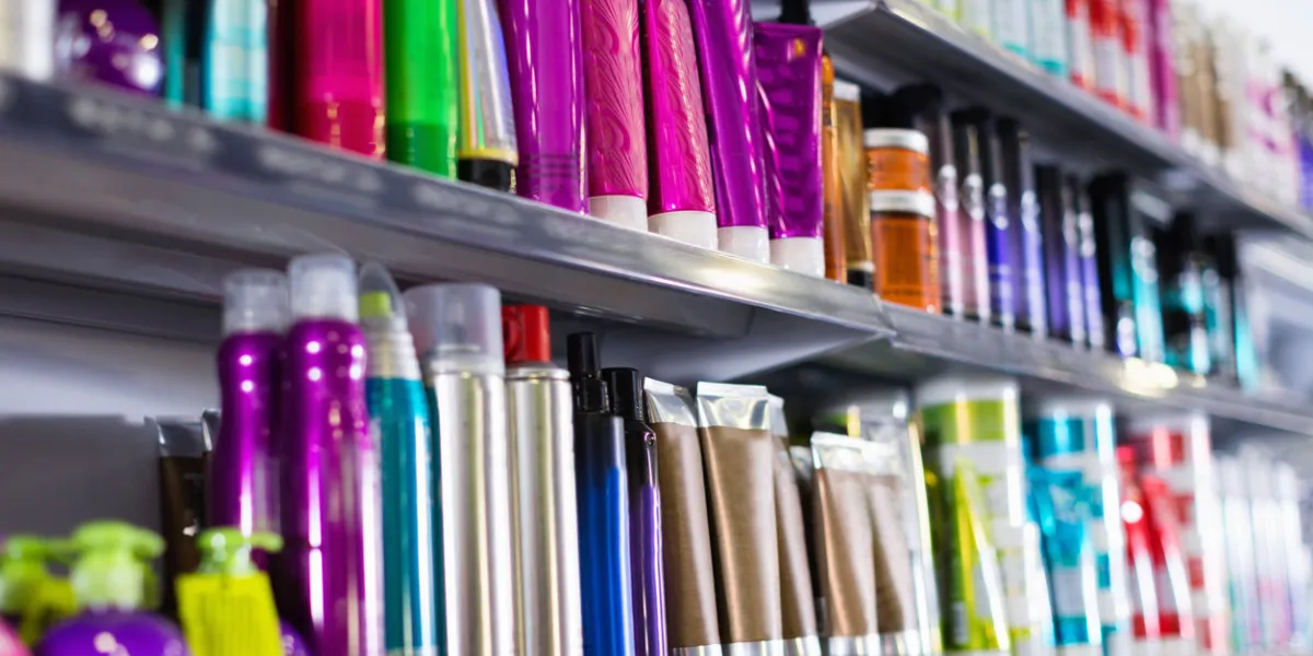 shelves with fashionable hair care products in a cosmetics showroom indoor shelves with fashionable hair care products in a cosmetics showroom indoor