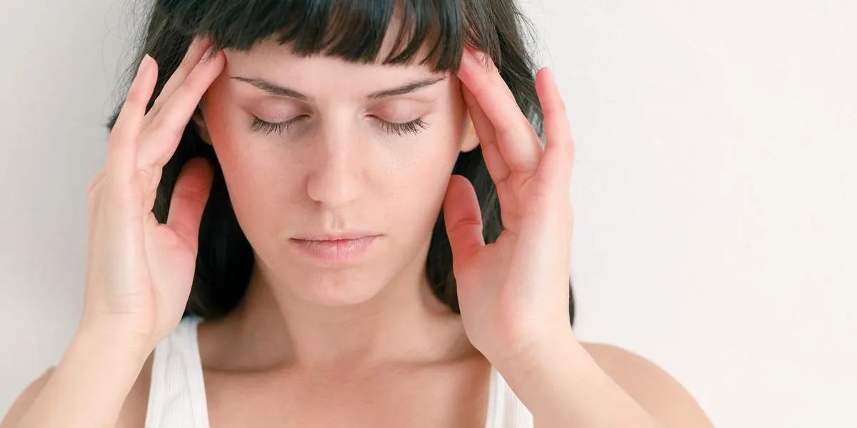 headache woman fingers on head eyes closed headache woman fingers on head eyes closed