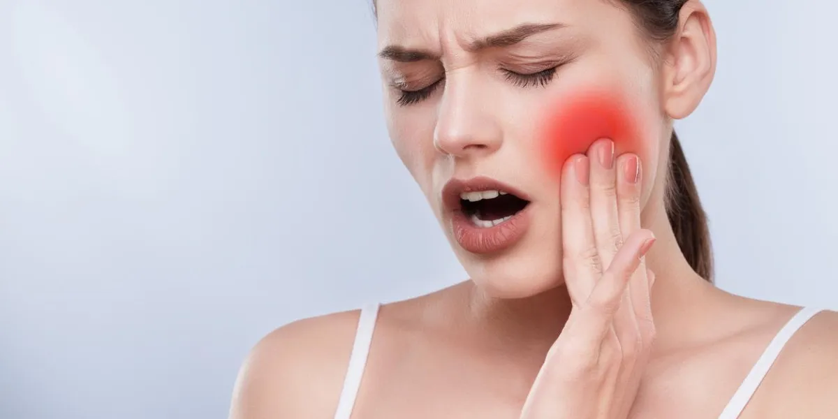 head and shoulders of girl with painful face expression, holding hand on cheek, tooth ache patient with closed eyes suffering from tooth ache, stomatological concept head and shoulders of girl with painful face expression, holding hand on cheek, tooth ache patient with closed eyes suffering from tooth ache, stomatological concept
