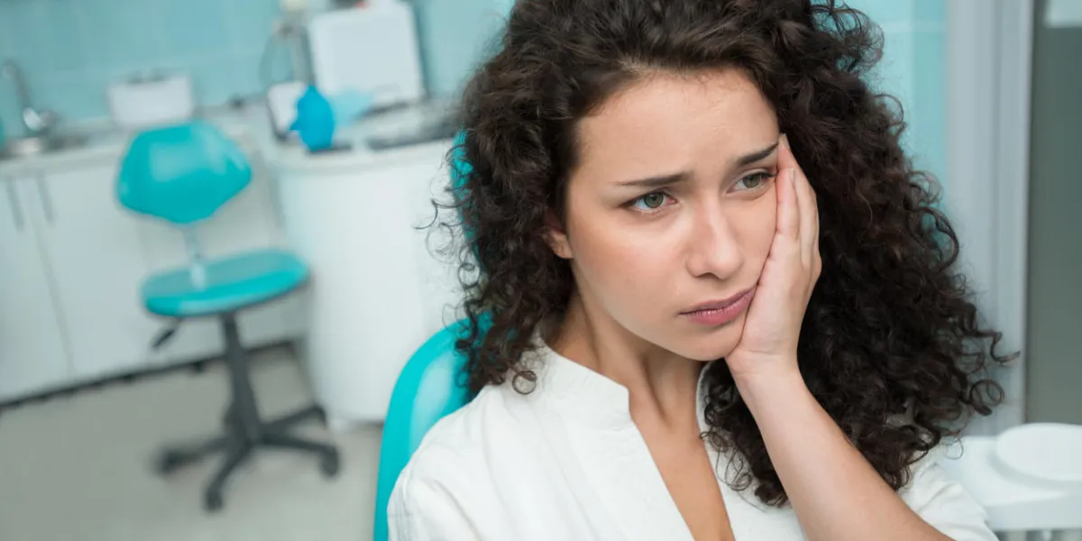 portrait of a young woman suffering from toothache portrait of a young woman suffering from toothache