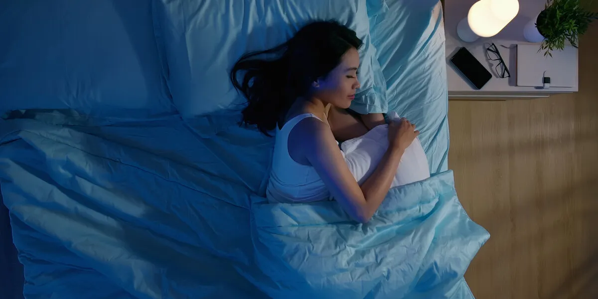 overlooking of asian woman sleep well with smile at night