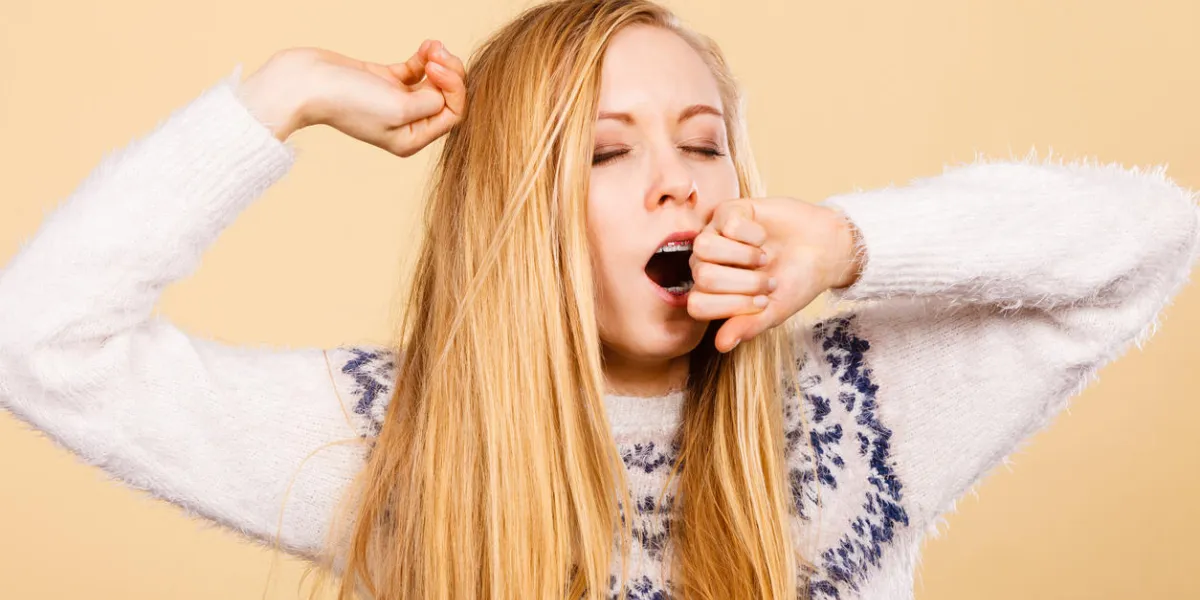 tiredness, too much work at school concept sleepy yawning blonde teenage woman in jumper feeling exhausted tiredness, too much work at school concept sleepy yawning blonde teenage woman in jumper feeling exhausted