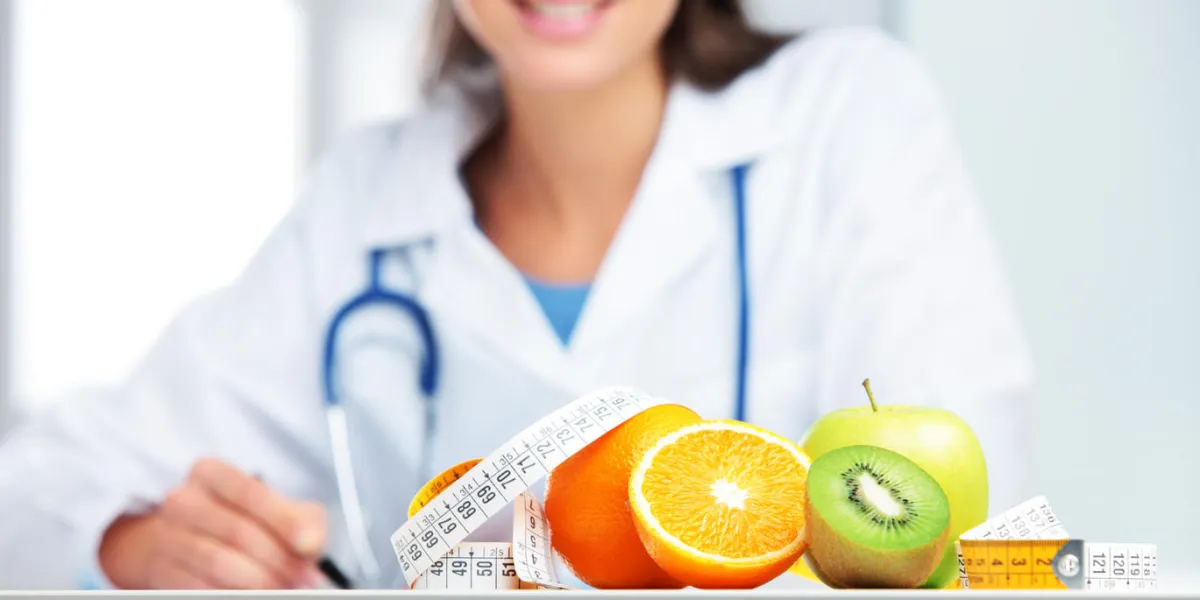 nutritionist female doctor in her office focus on fruit