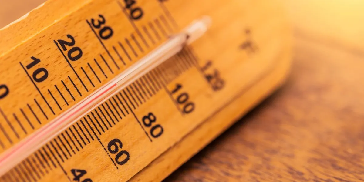 hot day summer concept closeup thermometer with warm color tone hot day summer concept closeup thermometer with warm color tone