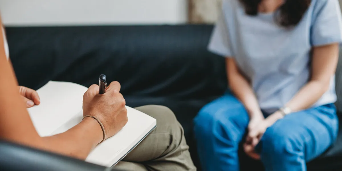 psychotherapy session, woman talking to his psychologist in the psychotherapy session, woman talking to his psychologist in the