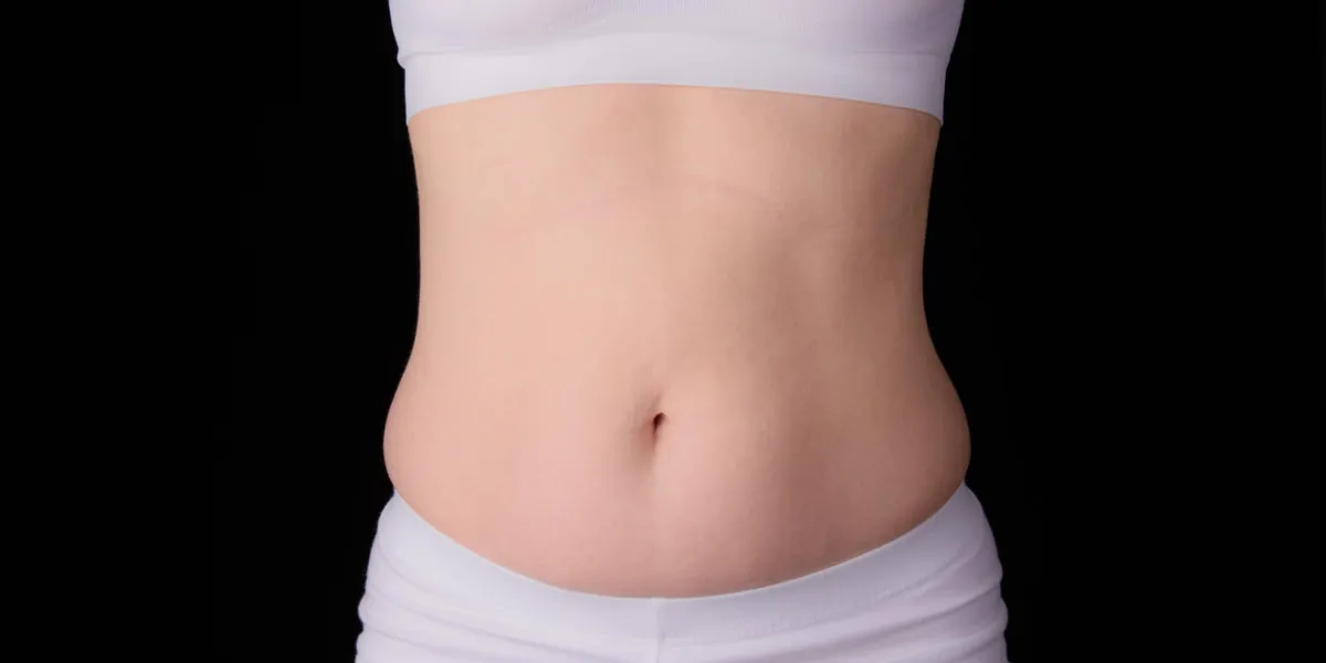 front view of woman with belly bulge