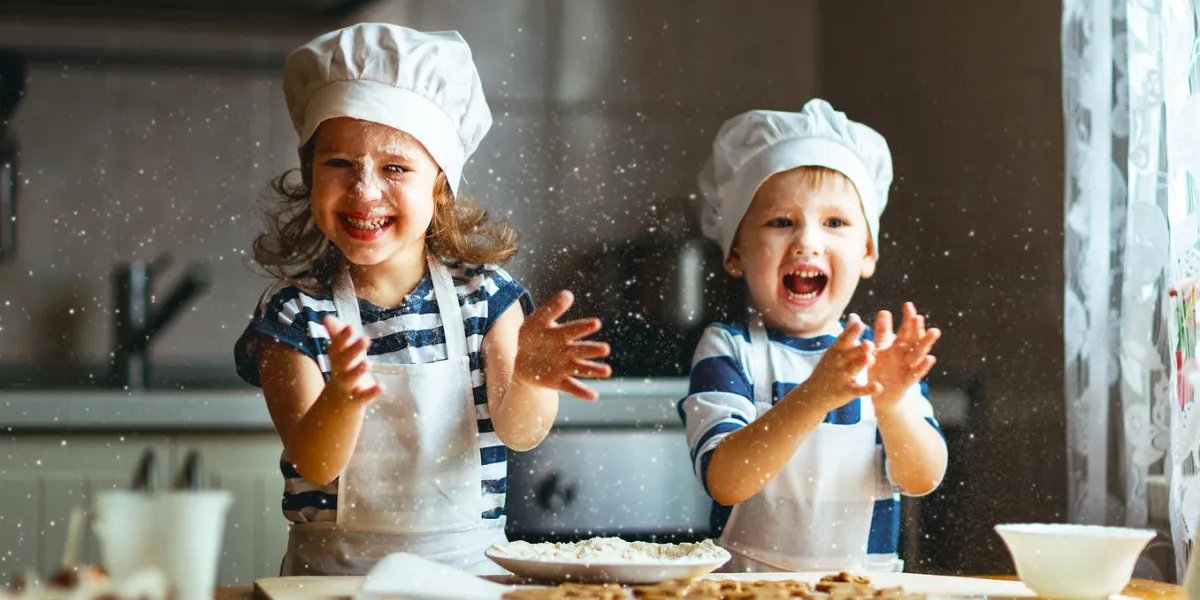 happy family funny kids are preparing the dough, bake cookies in the kitchen happy family funny kids are preparing the dough, bake cookies in the kitchen