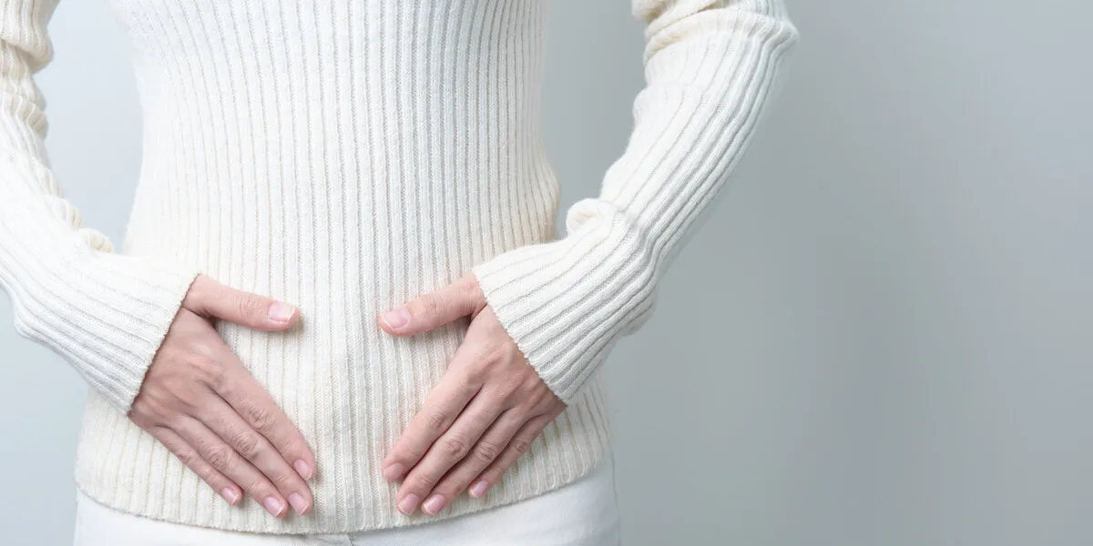 woman holding her belly pregnancy, reproductive system, menstruation, and gynecology concept