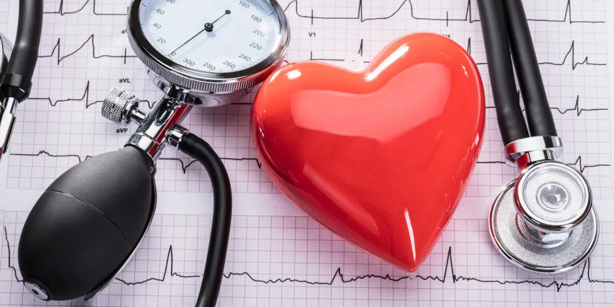 cardiogram of heart beat with stethoscope, sphygmomanometer and heart